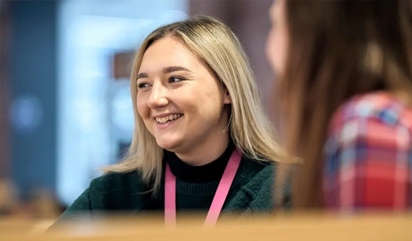 Image of woman smiling and text reading: Great humans needed, at the heart of every great change is a great human. Accenture is now hiring across Operations.